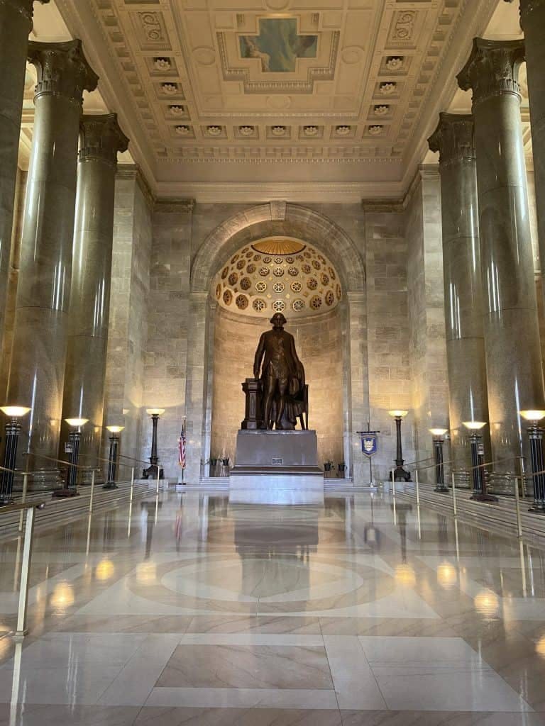 Memorial Theater with statue, elegant venue for formal gatherings and ceremonies.