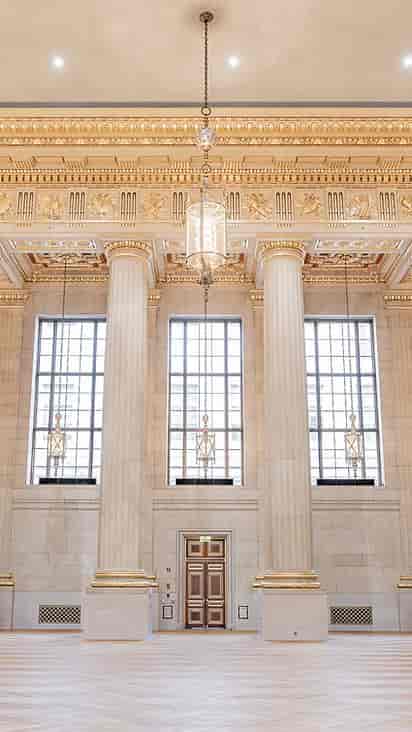 Grand Great Hall with elegant columns and chandelier, ideal for upscale events.