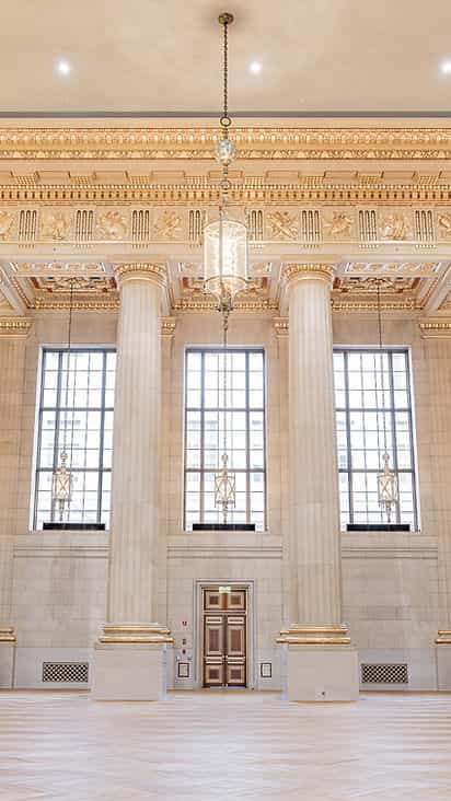 Grand Great Hall with elegant columns and chandelier, ideal for upscale events.