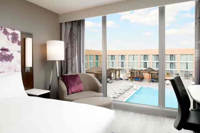 Modern hotel room with large windows, ideal for events near Potomac River, Washington DC.