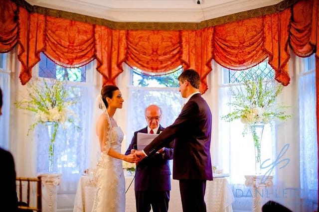 Intimate wedding ceremony in a beautifully decorated garden at The Whittemore House.