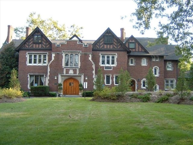 Historic Whittemore House garden, elegant brick facade, perfect for upscale events.