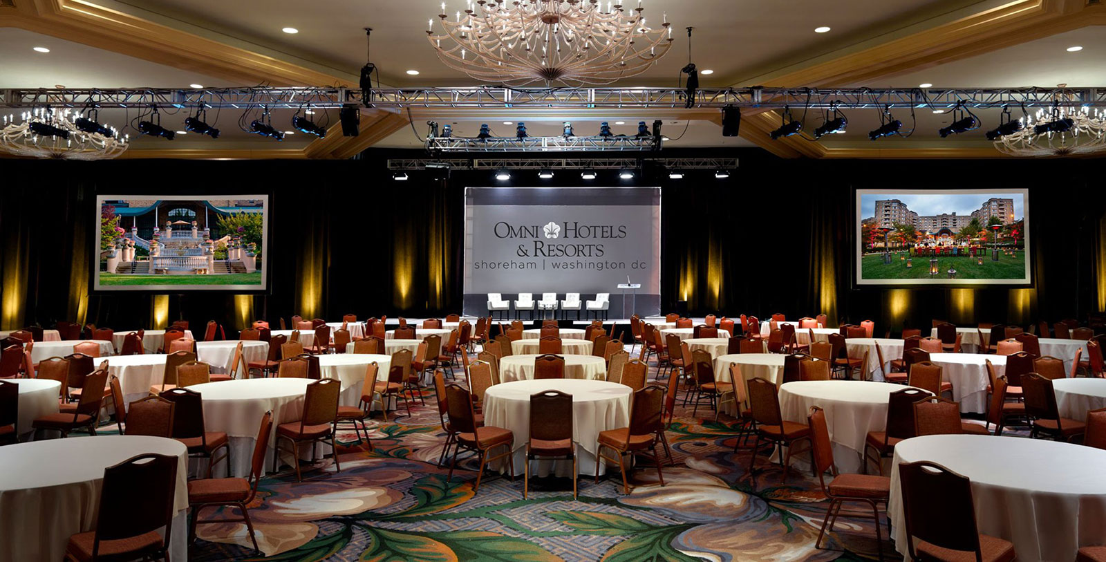 Governors Room at JW Marriott DC, set for corporate conferences with round tables and stage.