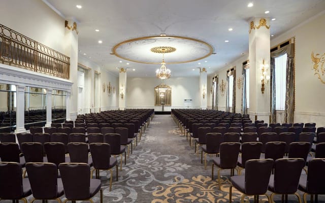 Elegant meeting room at JW Marriott DC with dark chairs, ideal for conferences and events.