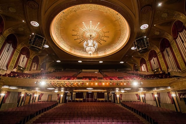 Elegant Warner Theatre marquee with ornate ceiling, ideal for events and performances.
