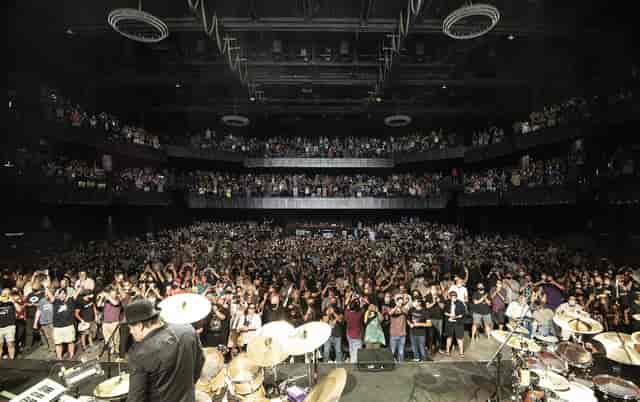 Packed concert hall at The Anthem with vibrant audience, showcasing live event atmosphere.
