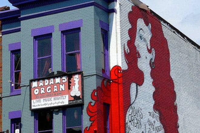 Vibrant bar mural at Madam's Organ, perfect for live music and themed events.