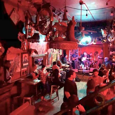 Vibrant bar at Madam's Organ, cozy venue for live performances and gatherings.