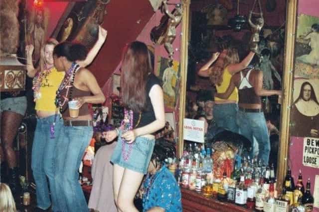Bar at Madam's Organ featuring vibrant decor, live music venue, Washington DC nightlife.