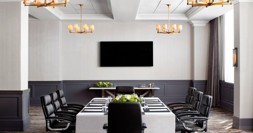 Georgetown Ballroom at St. Gregory Hotel, modern meeting room with elegant chandeliers.