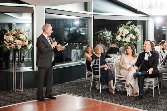 Penthouse event at Top of the Town with speaker, elegant decor, and engaged audience.