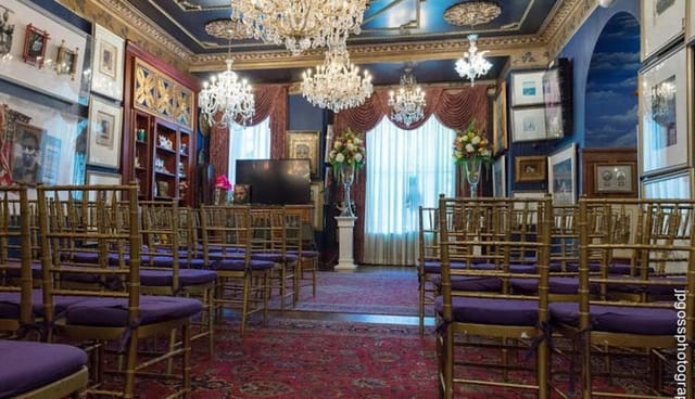 Elegant conference room with gold chiavari chairs, perfect for networking events.