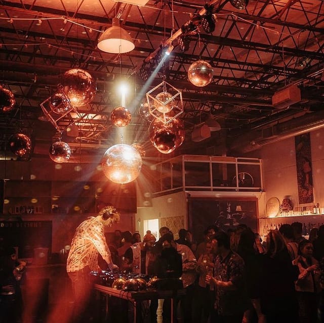 Vibrant bar with disco balls at Songbyrd Music House for social events and celebrations.