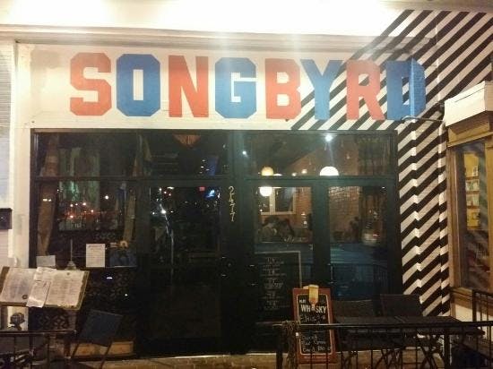 Colorful entrance of Songbyrd Music House, perfect for casual gatherings and events.