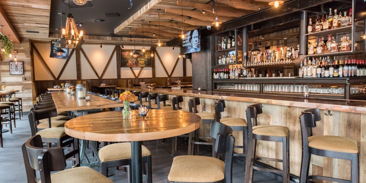 Cozy restaurant venue with wooden accents, perfect for gatherings and meetings.