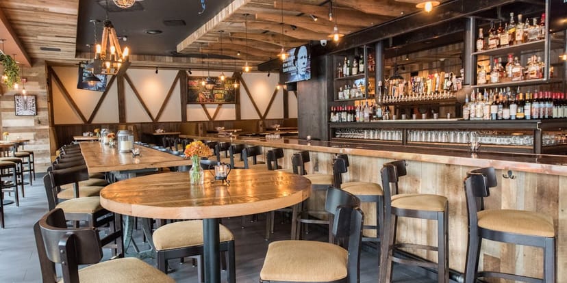 Cozy restaurant venue with wooden accents, perfect for gatherings and meetings.