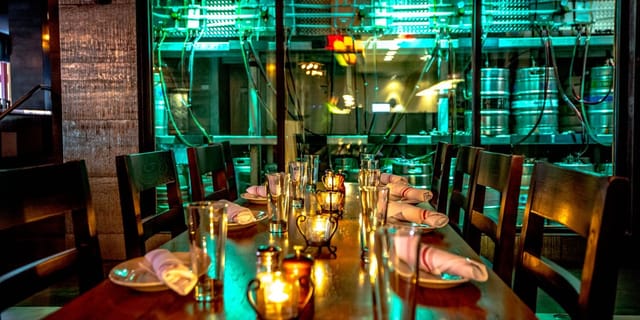 Private events dining table with candlelight at City Tap House, ideal for gatherings.