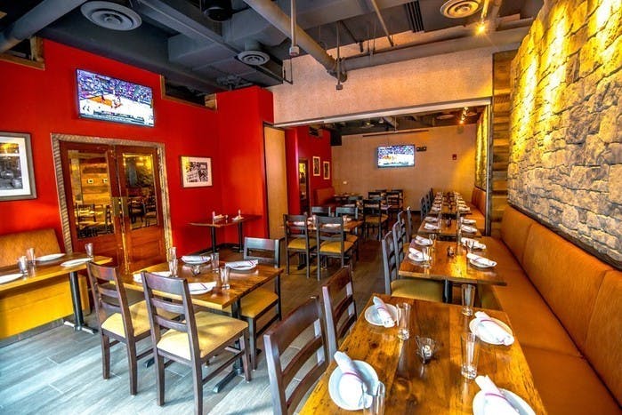 Private events space at City Tap House with warm decor, ideal for meetings and gatherings.