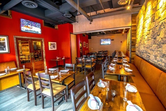 Private events space at City Tap House with warm decor, ideal for meetings and gatherings.