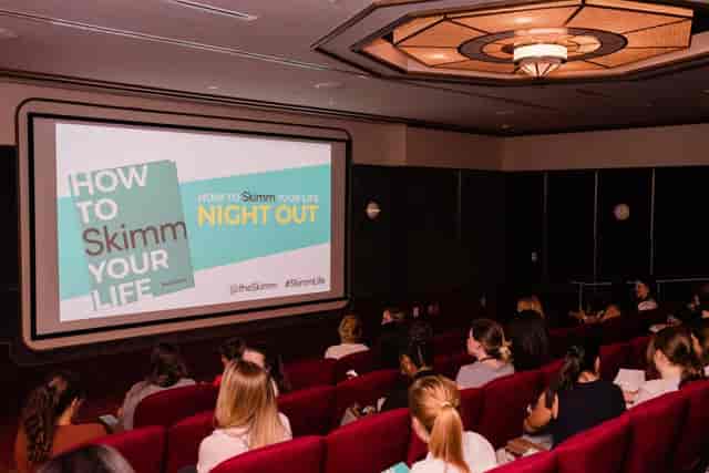 Eaton DC cinema event space for "How to Skimm Your Life" presentation with engaged audience.