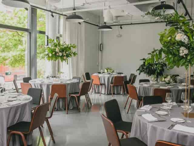 Sophisticated event space in Eaton DC with elegant gray tables and floral centerpieces.