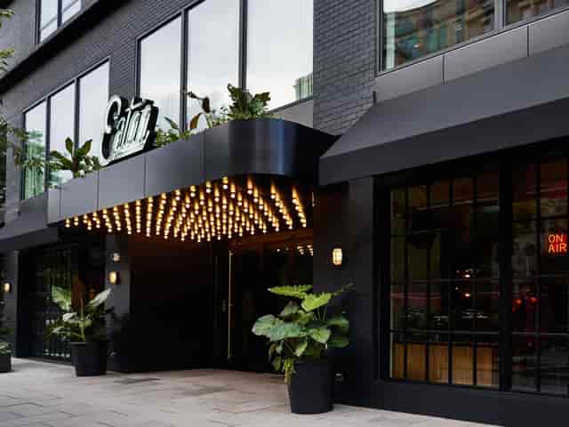 Modern venue entrance with stylish lighting and greenery for upscale events in Eaton DC.