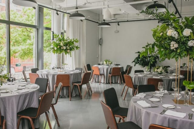 Modern event space in Eaton DC with elegant round tables for weddings and corporate functions.