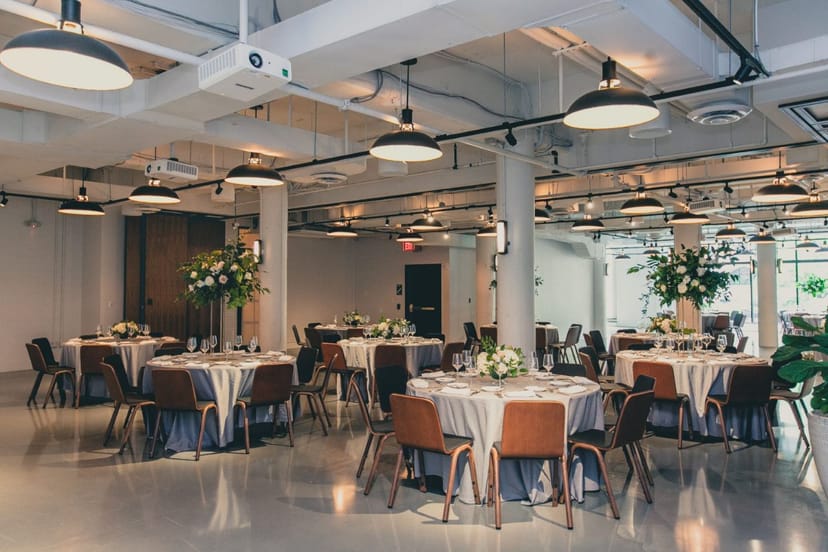 Modern event space in Eaton DC with elegant round tables for corporate gatherings.