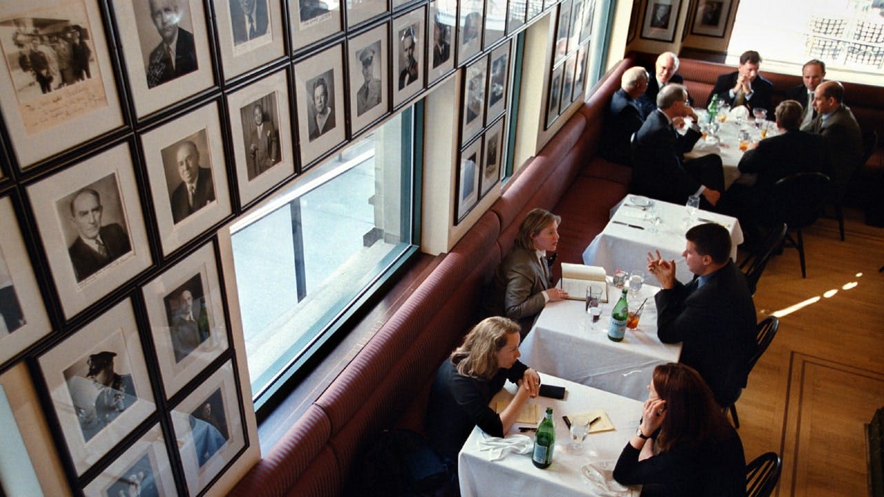 Sophisticated bar & grill dining setting for networking events with natural light.