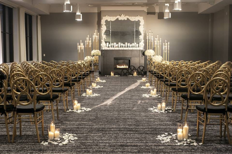 Elegant wedding ceremony setup with gold chairs and floral arrangements at The Occidental.