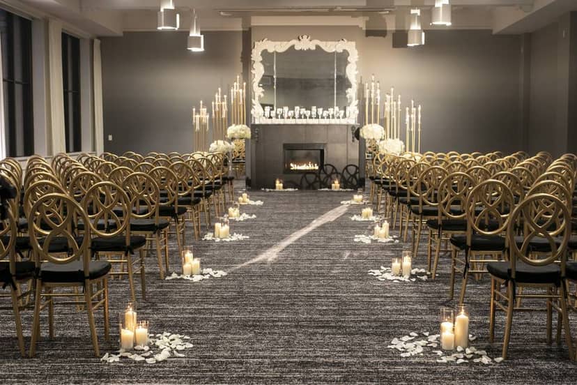 Elegant wedding ceremony setup with gold chairs and floral arrangements at The Occidental.
