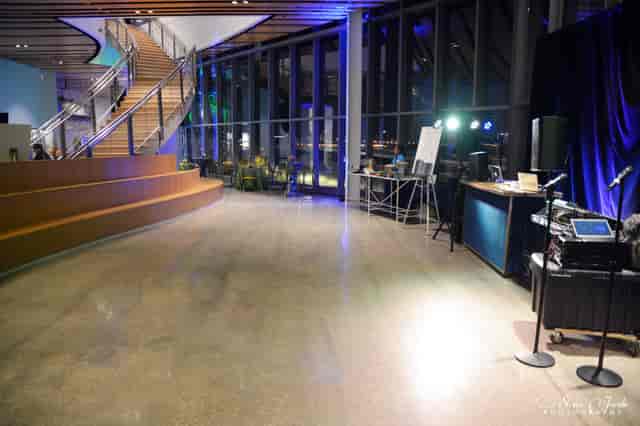 Modern event venue with natural light, ideal for networking and presentations.