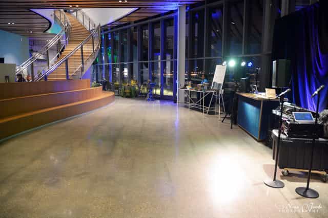 Modern event venue with natural light, ideal for networking and presentations.