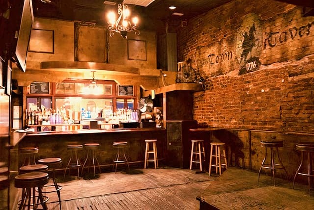Rustic event venue with exposed brick, ideal for intimate gatherings and networking.