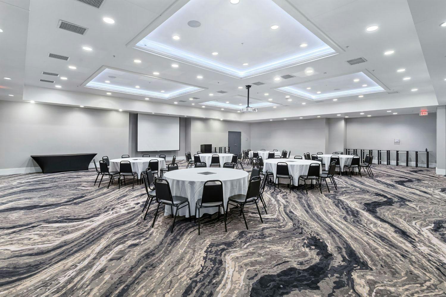 Harborside Ballroom at Topgolf D.C. with round tables for events and networking.