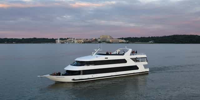 Sleek yacht on calm waters for upscale private boat charter events in Washington DC.
