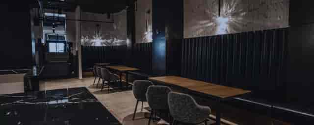 Private workspace in The Gathering Spot with sleek tables for networking events.
