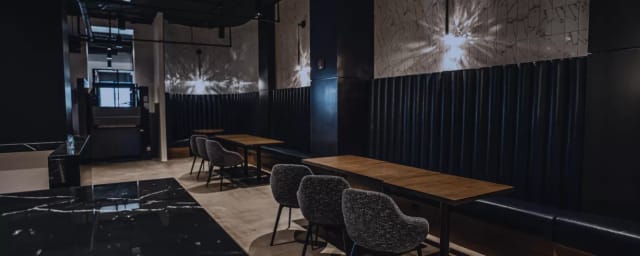 Private workspace in The Gathering Spot with sleek tables for networking events.