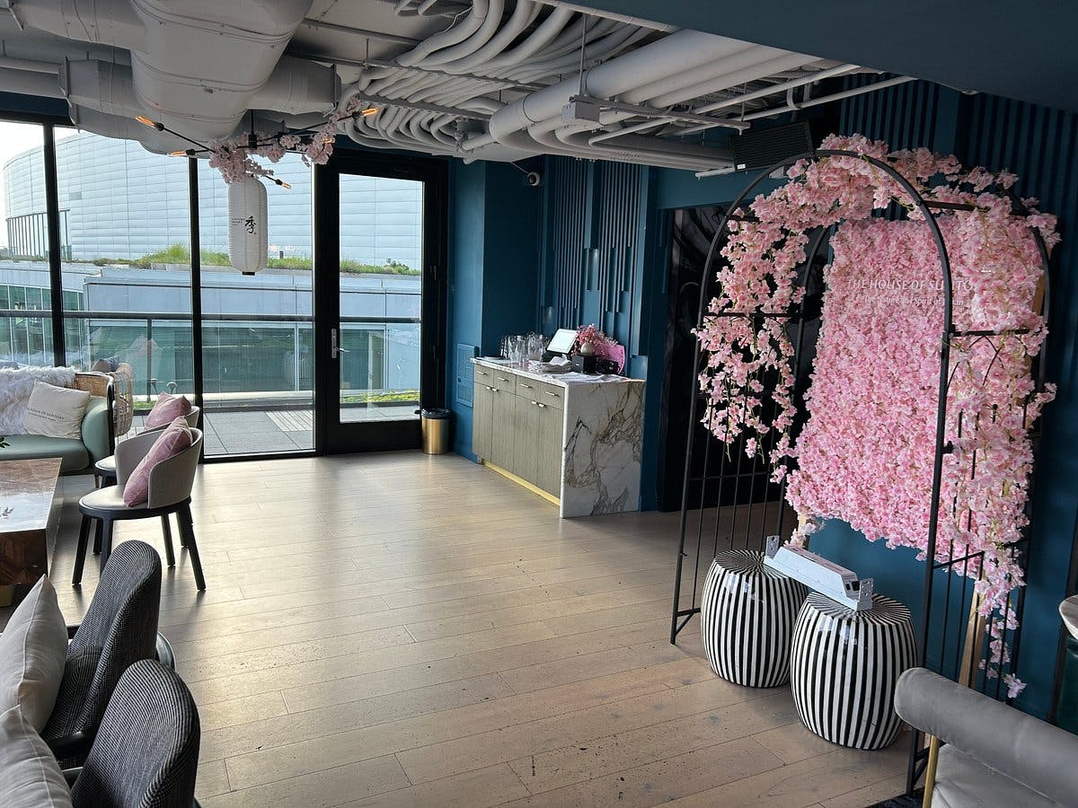Stylish Ciel Social Club bar with floral arch, perfect for events and gatherings.