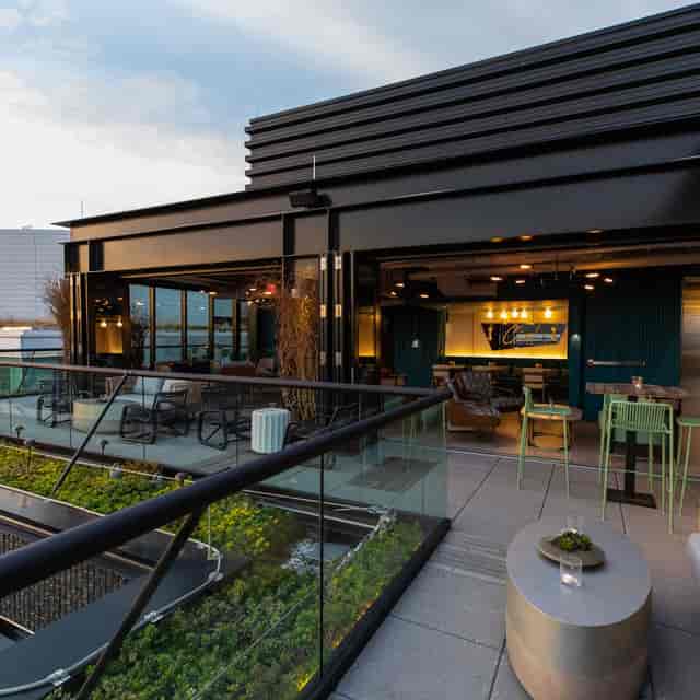 Modern rooftop bar with outdoor terrace, ideal for upscale events and gatherings.