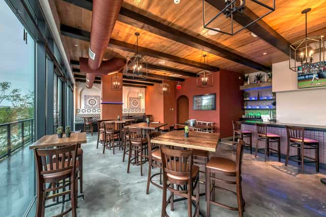 Cactus Room at Mission Navy Yard: modern event space with rustic beams, ideal for gatherings.