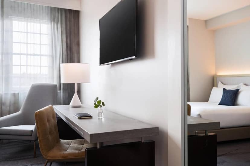 Modern hotel room at Archer Hotel Alexandria, ideal for meetings and business events.