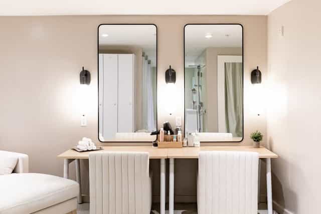 Liberty A/B prep area in Archer Hotel Alexandria with dual mirrors for events.