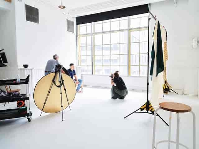 Well-lit Studio 02 with minimalist backdrop for corporate headshots and branding sessions.