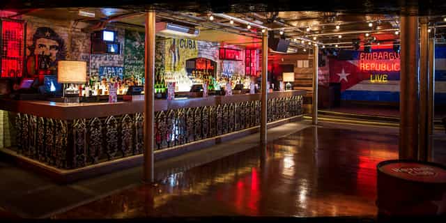 Vibrant cocktail bar with eclectic decor, perfect for social gatherings and events.