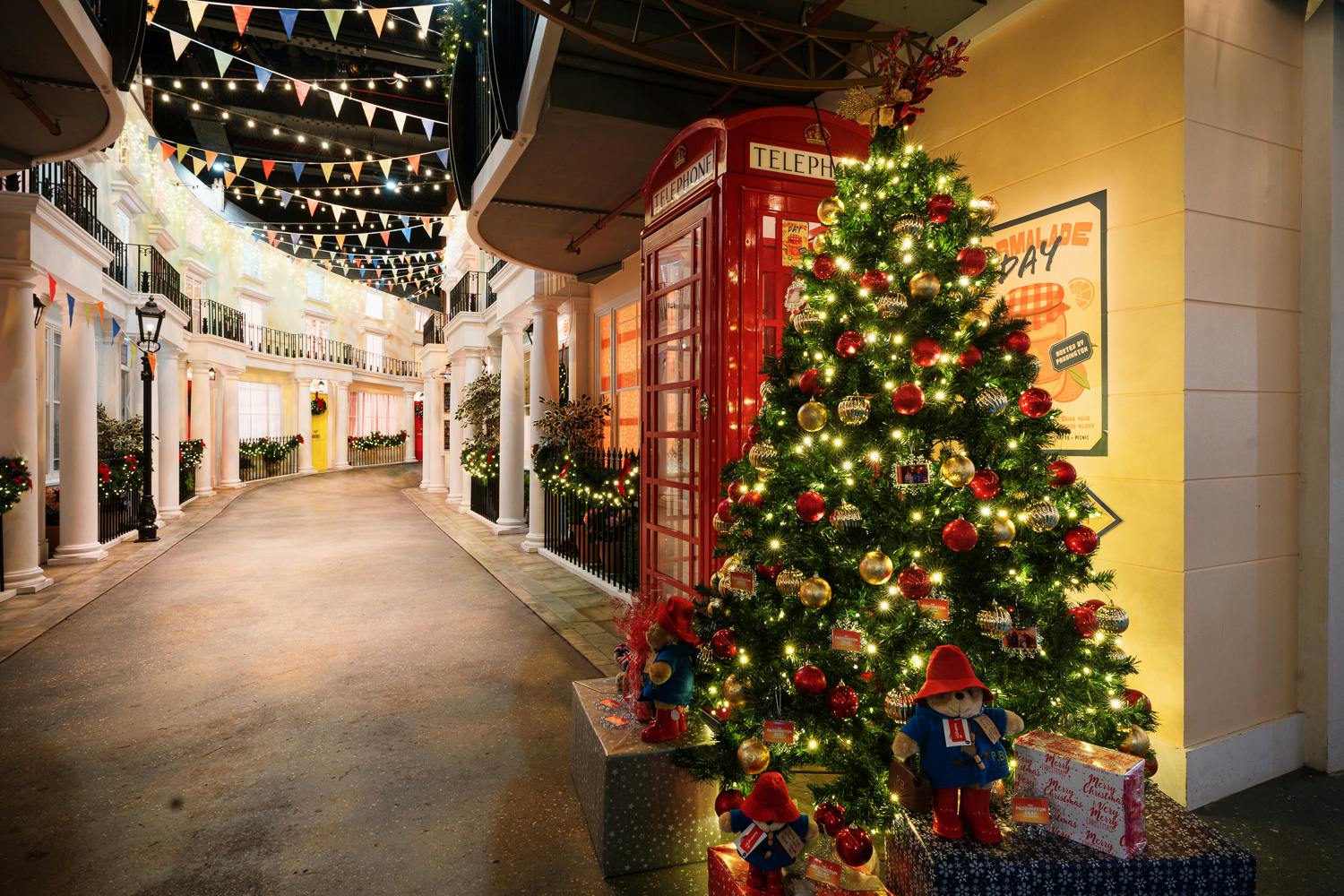 Christmas party at Paddington Bear Experience with festive tree and cozy decor.