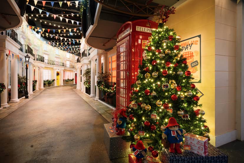 Christmas party at Paddington Bear Experience with festive tree and cozy decor.