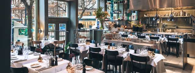 Stylish Nobis Hotel restaurant with elegant decor for corporate events and gatherings.