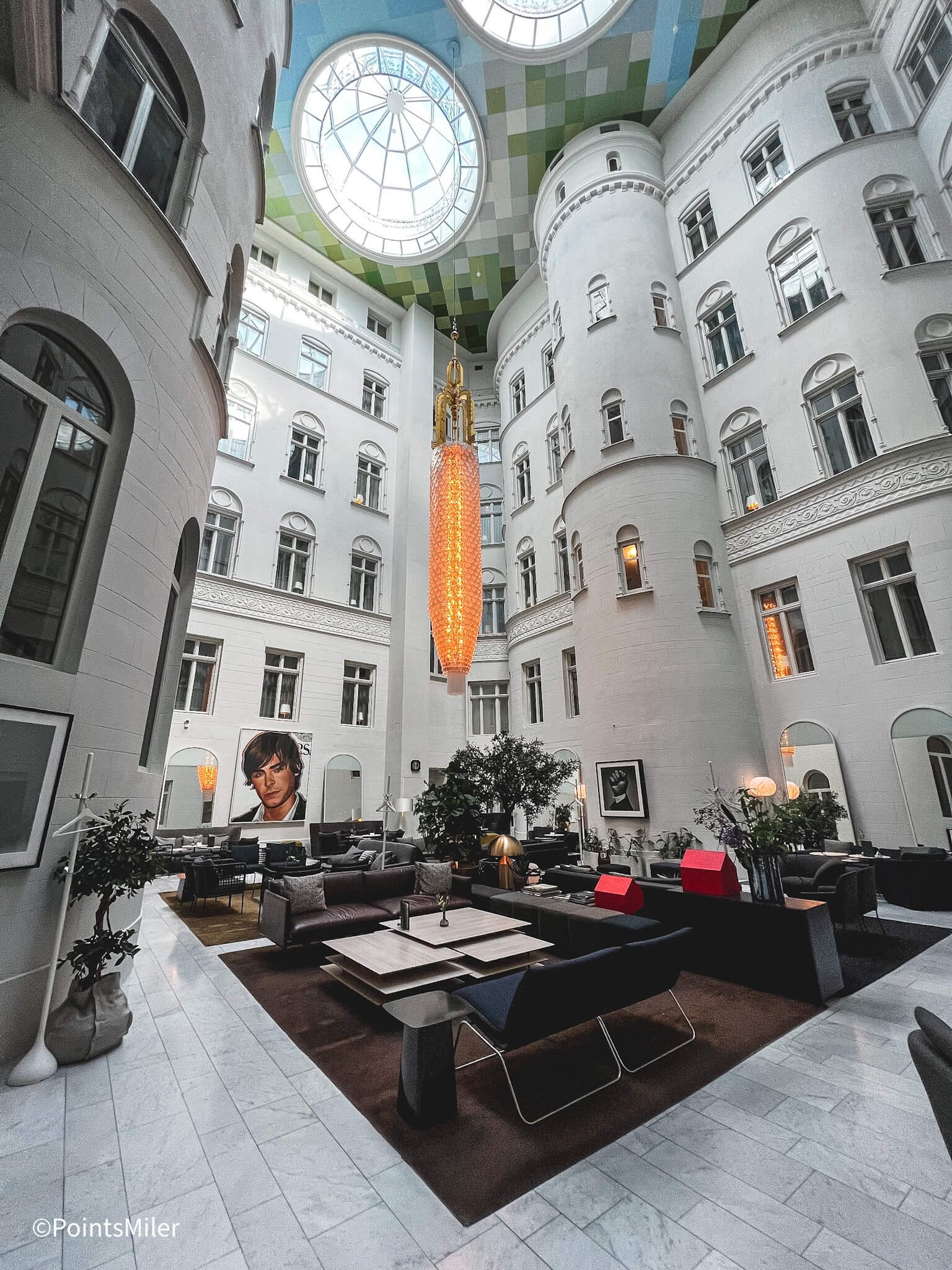 Modern lounge atrium at Nobis Hotel, perfect for networking events and meetings.