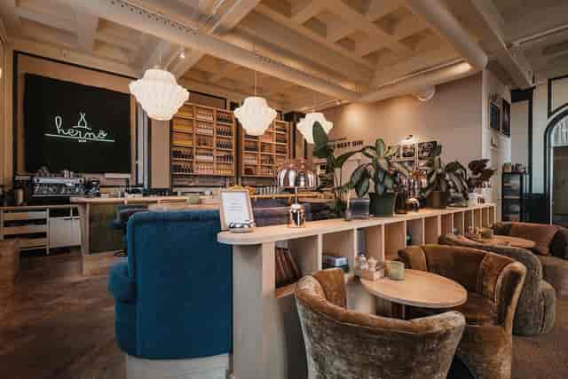 Stylish café with plush seating, perfect for networking events and informal meetings.